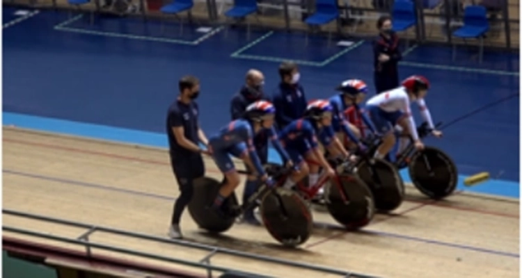 Cyclists in a velodrome